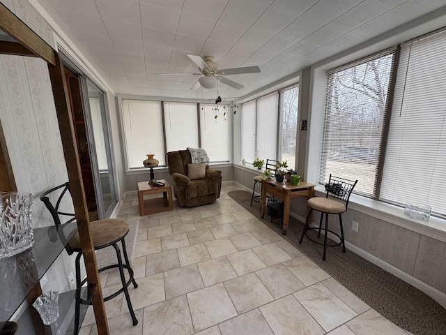 sunroom / solarium with ceiling fan