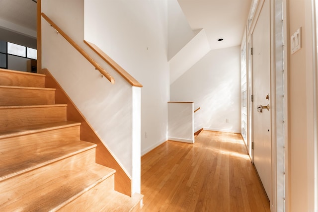 stairway featuring hardwood / wood-style flooring