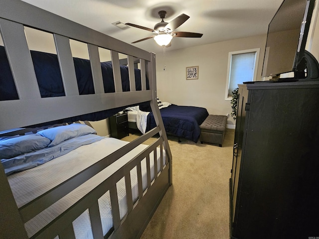 bedroom featuring ceiling fan and light colored carpet