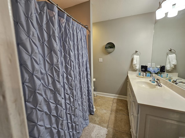 bathroom with tile patterned flooring and vanity