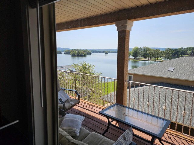 balcony featuring a water view