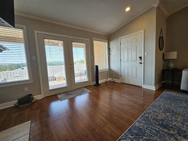 doorway to outside with dark hardwood / wood-style floors, lofted ceiling, ornamental molding, and french doors