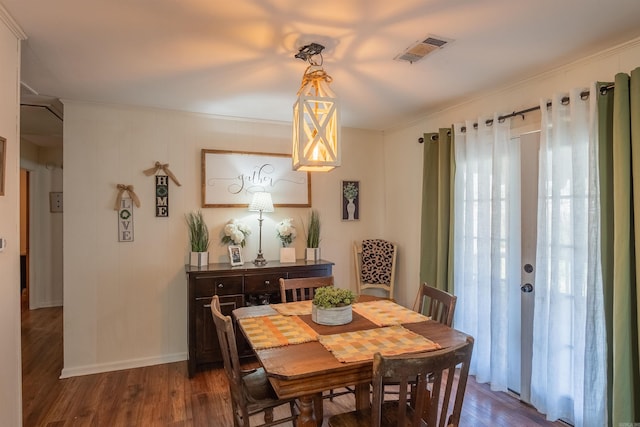 dining space featuring dark wood-type flooring