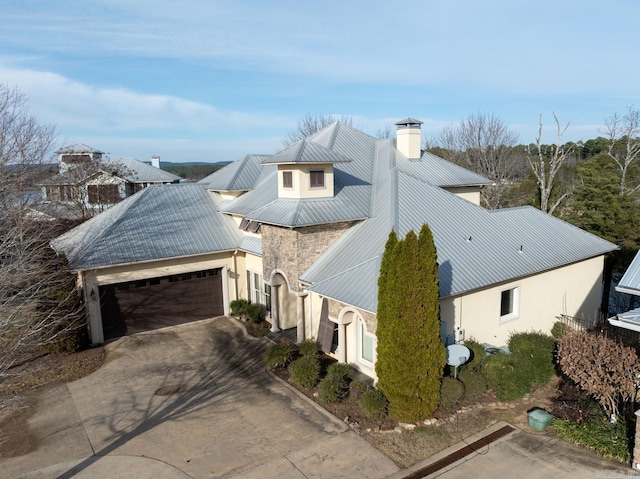 view of side of property with a garage