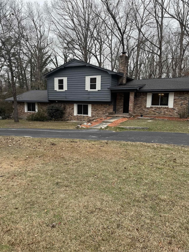 split level home with a front yard