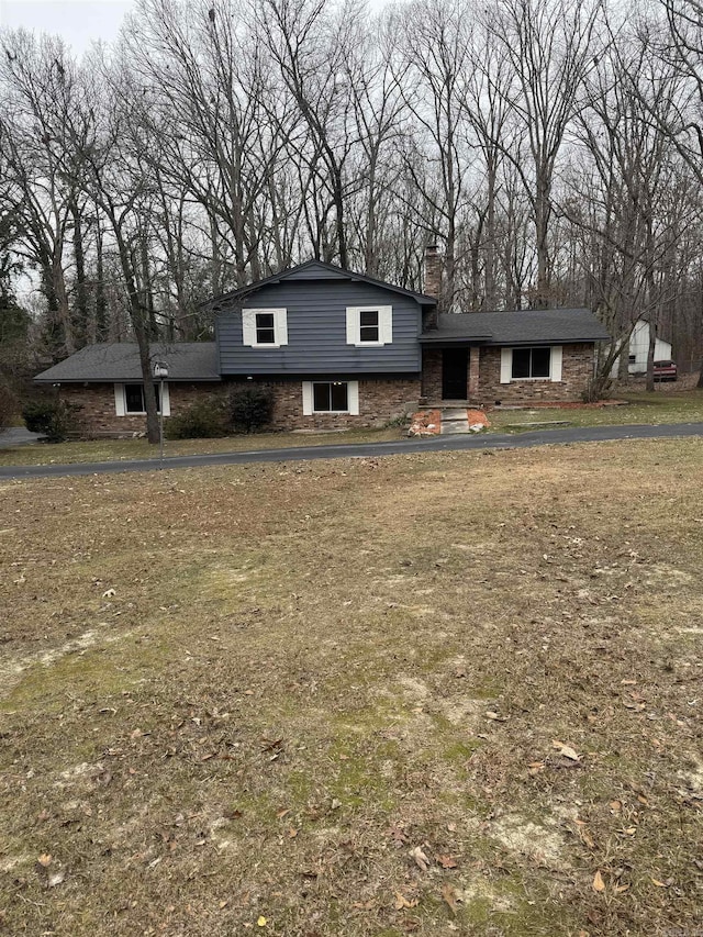 split level home with a front yard