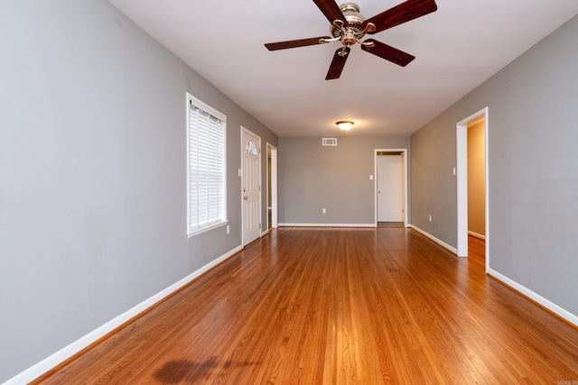 spare room featuring hardwood / wood-style flooring and ceiling fan