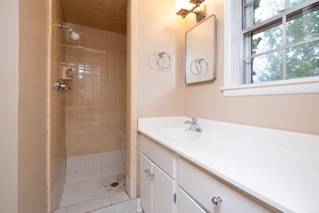 bathroom featuring vanity and tiled shower