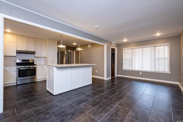 kitchen with white cabinetry, a center island, stainless steel appliances, decorative light fixtures, and decorative backsplash