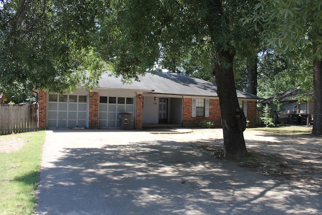 single story home featuring a garage