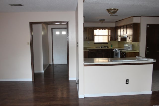 kitchen with white range with electric cooktop, dark brown cabinetry, sink, and a textured ceiling