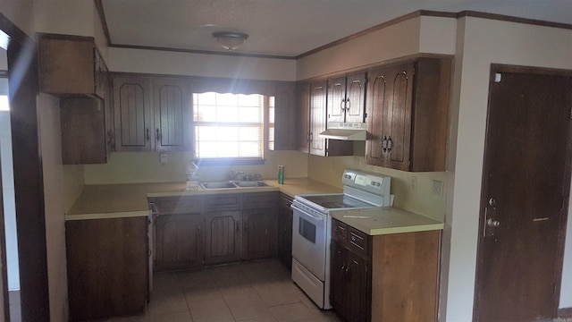 kitchen with white range oven, dark brown cabinetry, sink, and light tile patterned floors