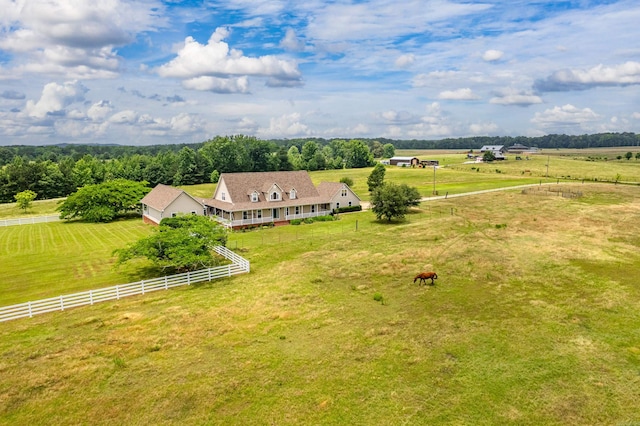 birds eye view of property with a rural view