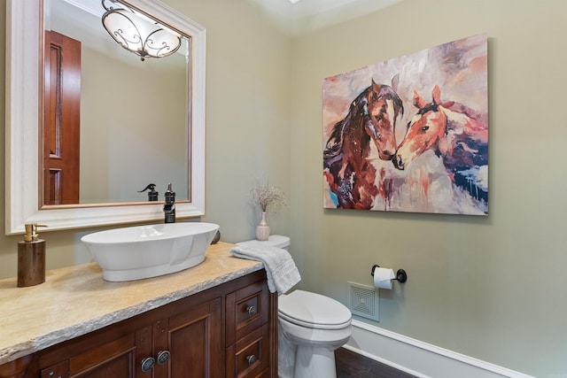 bathroom with vanity and toilet