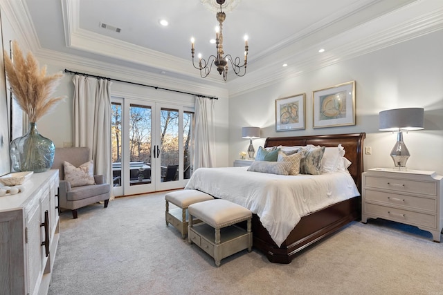 bedroom featuring french doors, access to outside, a tray ceiling, crown molding, and a notable chandelier