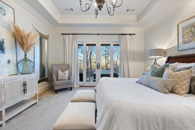 carpeted bedroom with an inviting chandelier, a raised ceiling, access to outside, and french doors