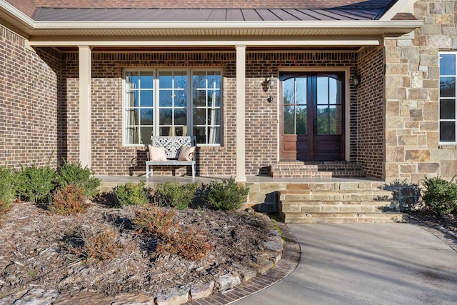 doorway to property featuring french doors and a porch