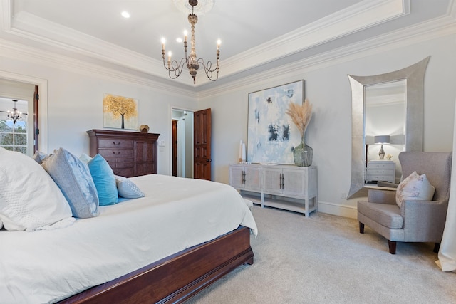 carpeted bedroom with a raised ceiling, ornamental molding, and a chandelier