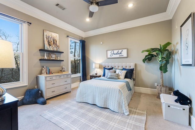 bedroom featuring ceiling fan, crown molding, and light colored carpet