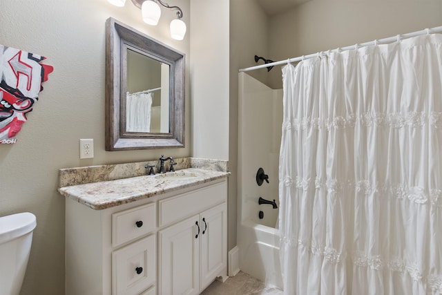 full bathroom with vanity, shower / bathtub combination with curtain, and toilet