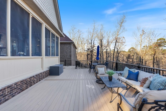 wooden deck featuring outdoor lounge area