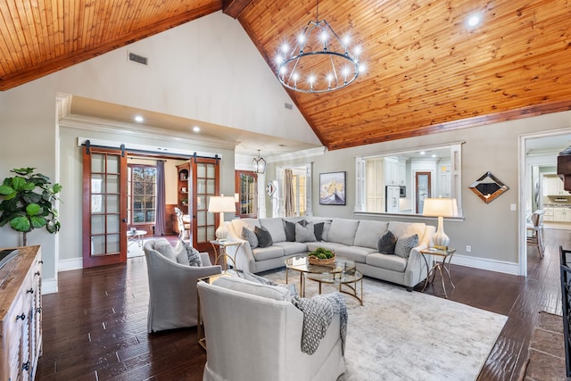 living room featuring dark wood-type flooring, high vaulted ceiling, a barn door, a notable chandelier, and wood ceiling