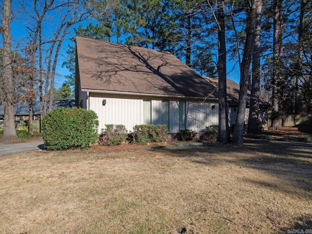 view of property exterior featuring a lawn