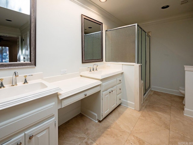 bathroom featuring vanity, toilet, a shower with shower door, and crown molding