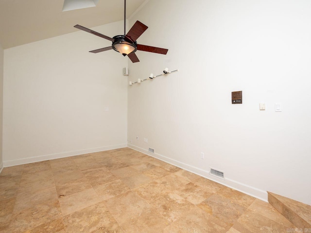 empty room with ceiling fan and lofted ceiling