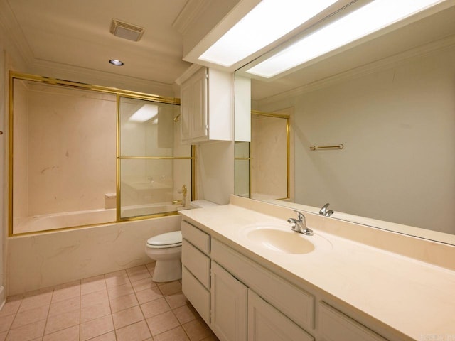 full bathroom with tile patterned floors, ornamental molding, vanity, enclosed tub / shower combo, and toilet