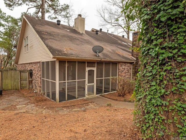 rear view of house with a sunroom