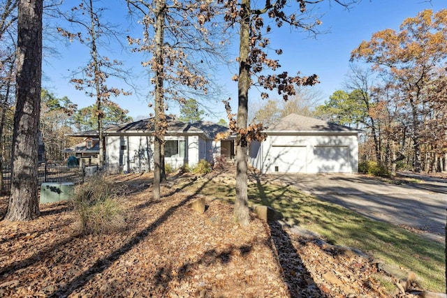 single story home with a garage