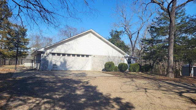 view of side of property featuring a garage