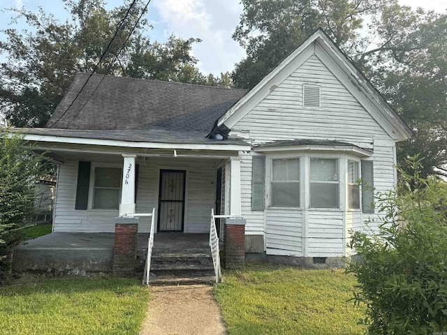 bungalow-style house with a porch and a front yard