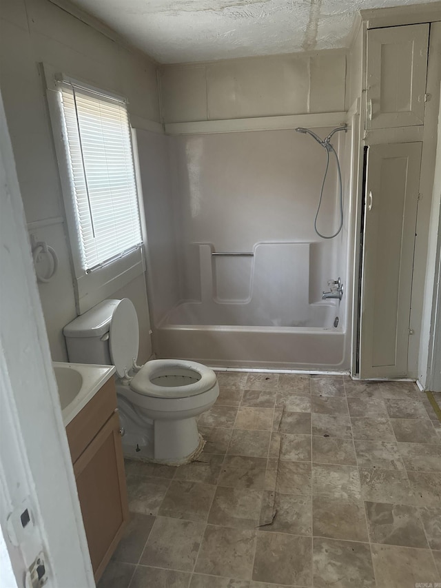 full bathroom with vanity, toilet, and bathtub / shower combination