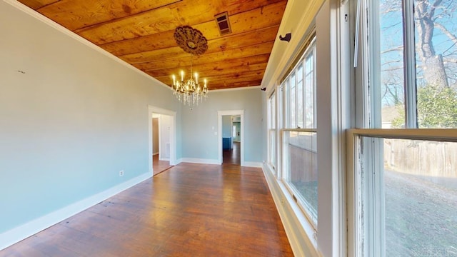 interior space featuring lofted ceiling, wooden ceiling, and a chandelier