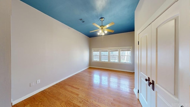 unfurnished room featuring ceiling fan and light wood-type flooring