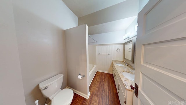 full bathroom featuring vanity, wood-type flooring, tub / shower combination, and toilet