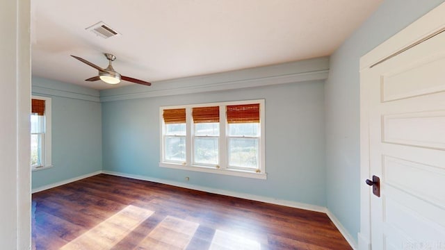 spare room featuring ceiling fan and dark hardwood / wood-style flooring