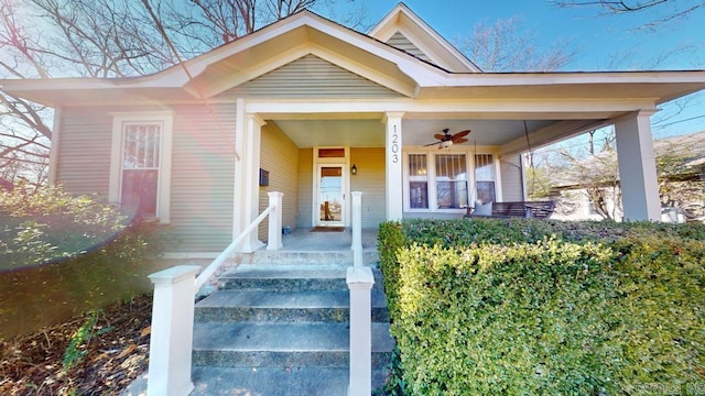 entrance to property featuring ceiling fan and a porch