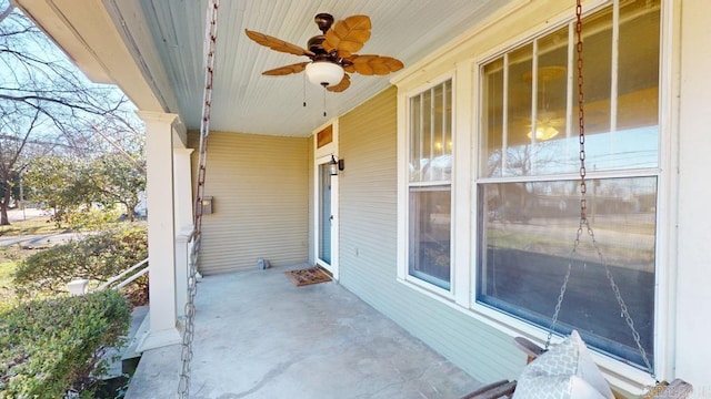 view of patio featuring ceiling fan and a porch