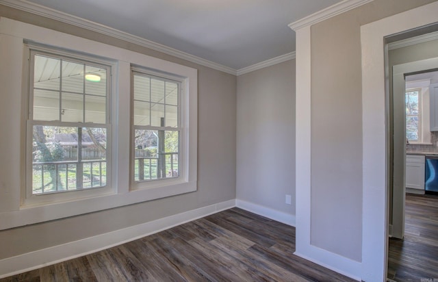 unfurnished room featuring crown molding, a wealth of natural light, and dark wood-type flooring