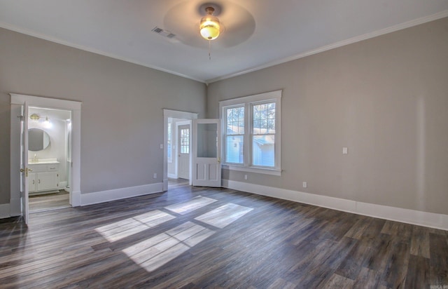 interior space featuring ceiling fan, ornamental molding, and dark wood-type flooring