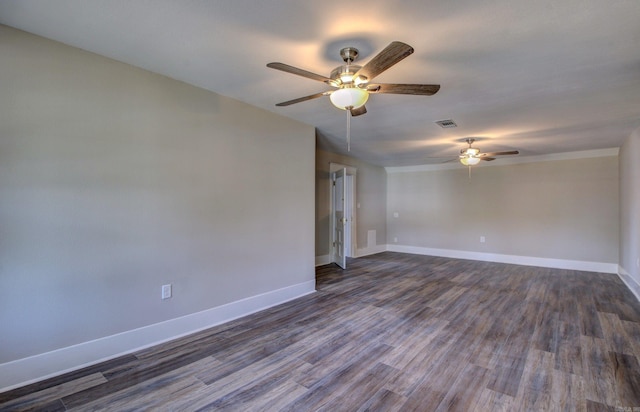 spare room with ceiling fan and dark hardwood / wood-style floors