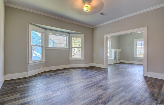 spare room with ceiling fan, a healthy amount of sunlight, and ornamental molding