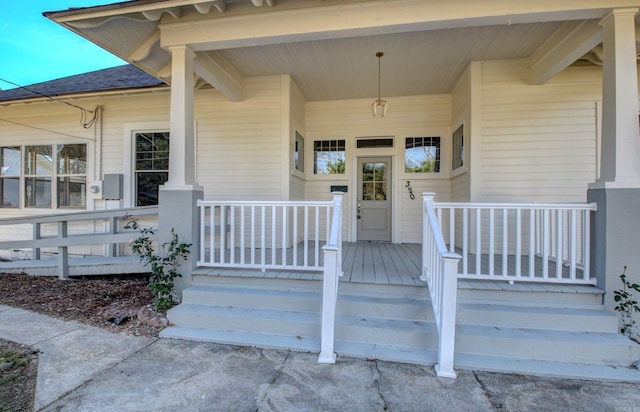 doorway to property featuring covered porch