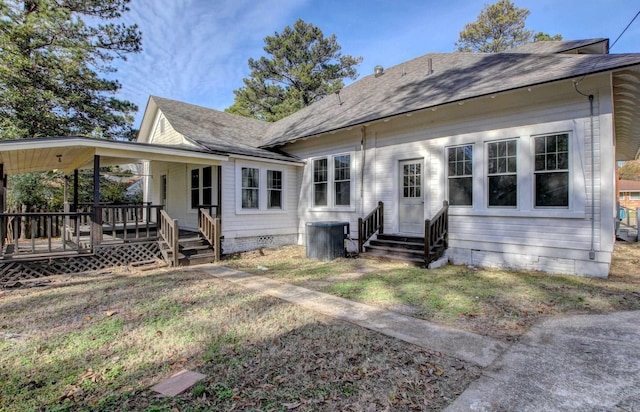 rear view of property featuring a porch