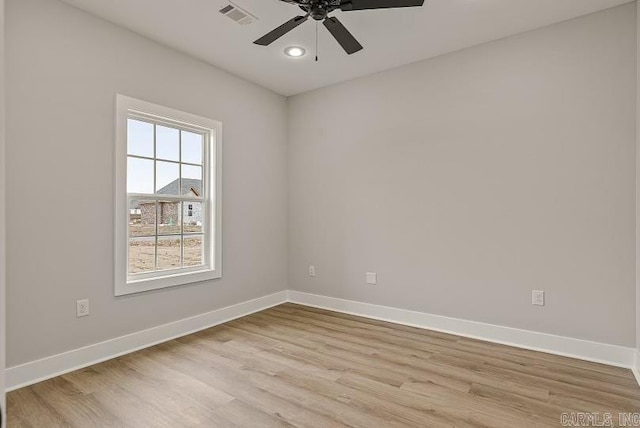 unfurnished room featuring light hardwood / wood-style floors and ceiling fan