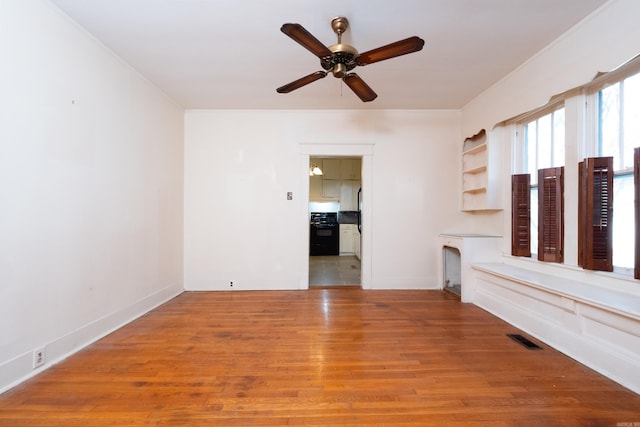 interior space with ceiling fan and light wood-type flooring