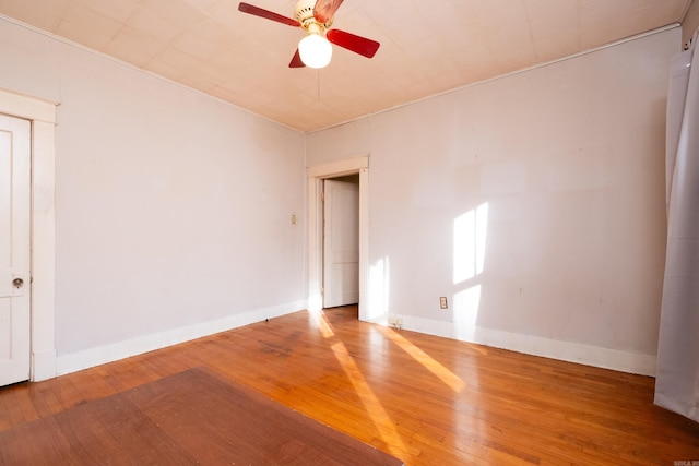 unfurnished room featuring ceiling fan and hardwood / wood-style floors